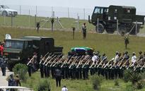 With 21-gun salute, fly-past and the 'Last Post' Nelson Mandela is laid to rest at his childhood home in Qunu