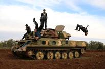Syrian youth practice parkour amid ruins of war
