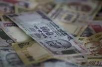 Rupee sinks 90 paise to record closing low of 58.77